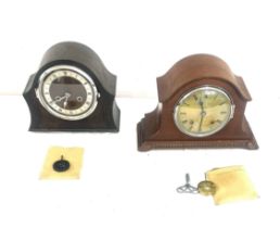 Two wooden two key hole mantel clocks one with key and pendulum, one with key only, both as found