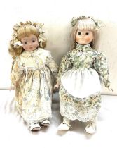 Two vintage pot dolls on stand