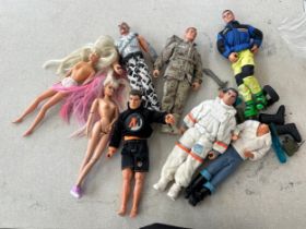 Selection of vintage dolls to include action men and barbie dolls