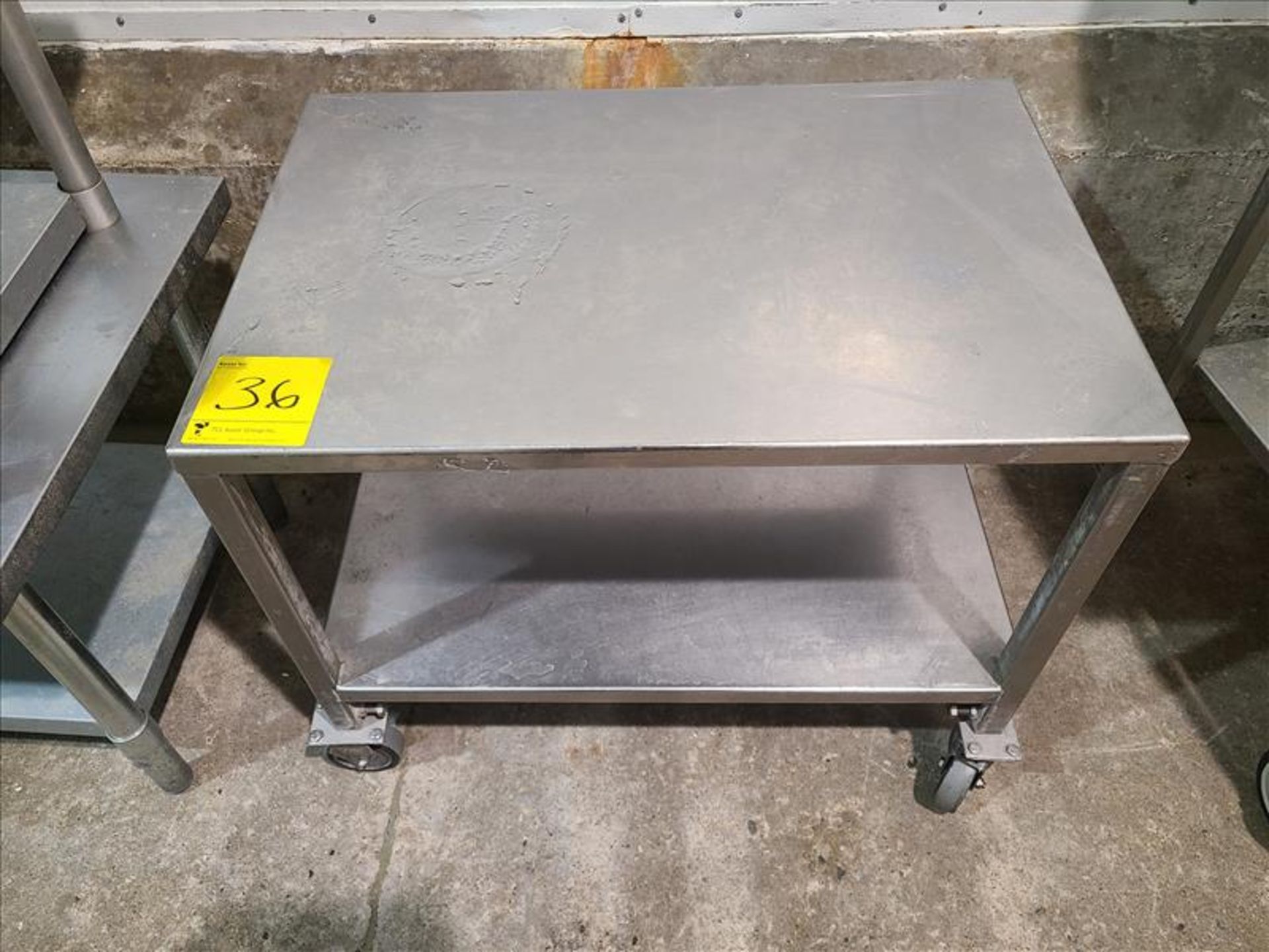 Table, stainless steel, casters, approx. 22 in. x 32 in. [Loc. Sanitation Room]