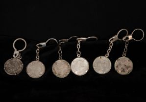 Lot of bracelet decorations made up of 925 silver coins, framed