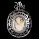 Exquisite reliquary medallion in fine silver and ivory with Flemish Christ and Saint James the Apost