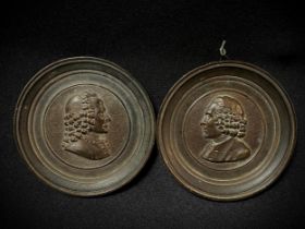 Pair of beautiful bronze Grand Tour medallions by Voltaire and Rousseau, France 19th century