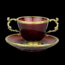Set of silver gilt mounted ruby glass (rubinglas) cup and saucer. German, late 19th century