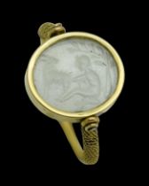 Gold Ring Set With an Intaglio In Chalcedony Of A Young Milking A Goat. Roman, 1st - 2nd century AD