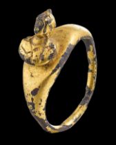 Gilt bronze finger ring with a bust of Minerva. Roman, 1st - 2nd century AD.