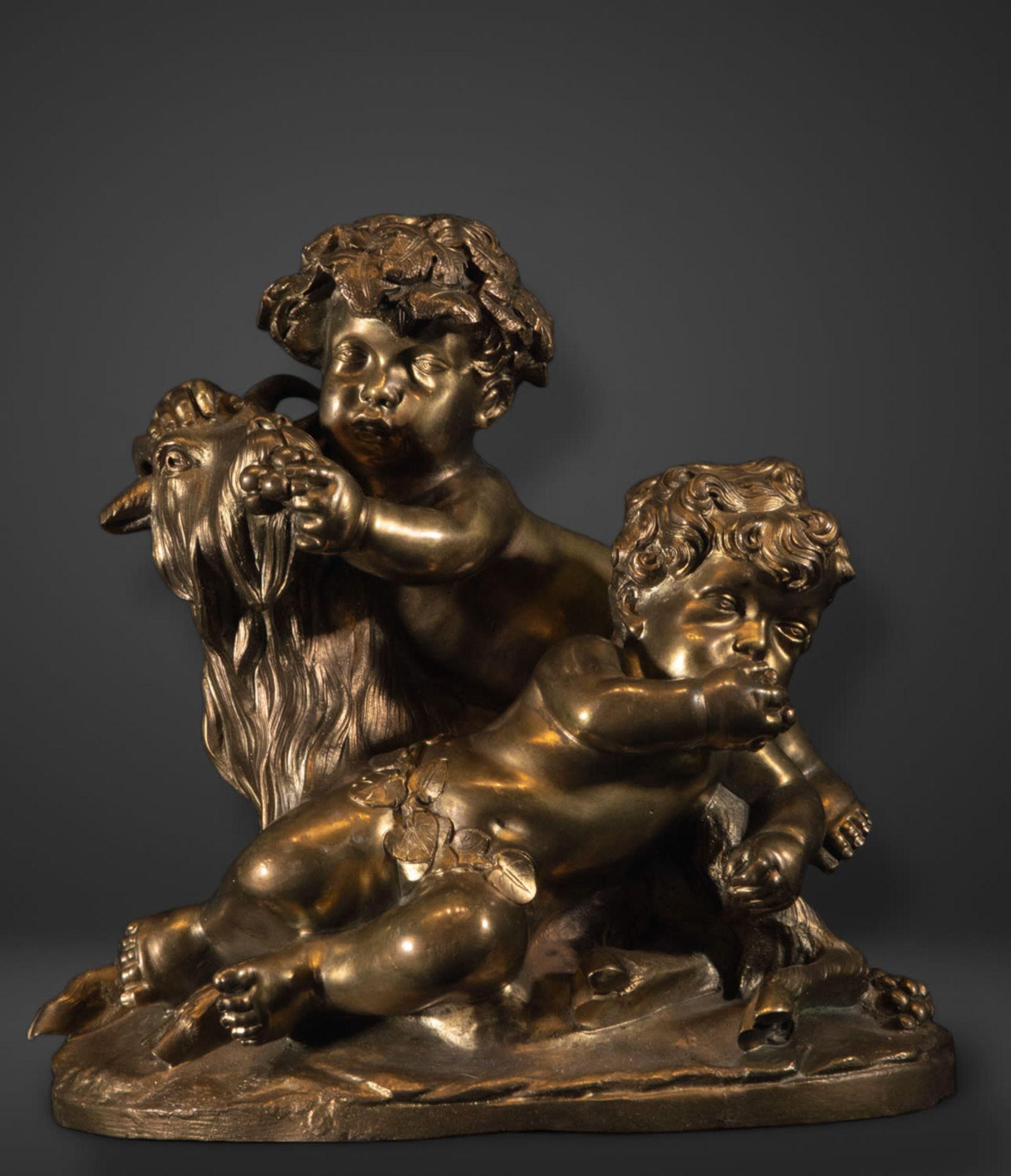 Allegorical French Beaux Arts sculpture of two Amours climbing a goat in patinated and gilded bronze