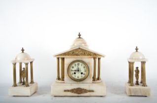 Alabaster garniture, circa 1890 - 1900, with a pair of temples and columns in gilt bronze