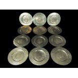 Important decorative set of 12 large display trays in silvered metal in the Spanish Philip II style