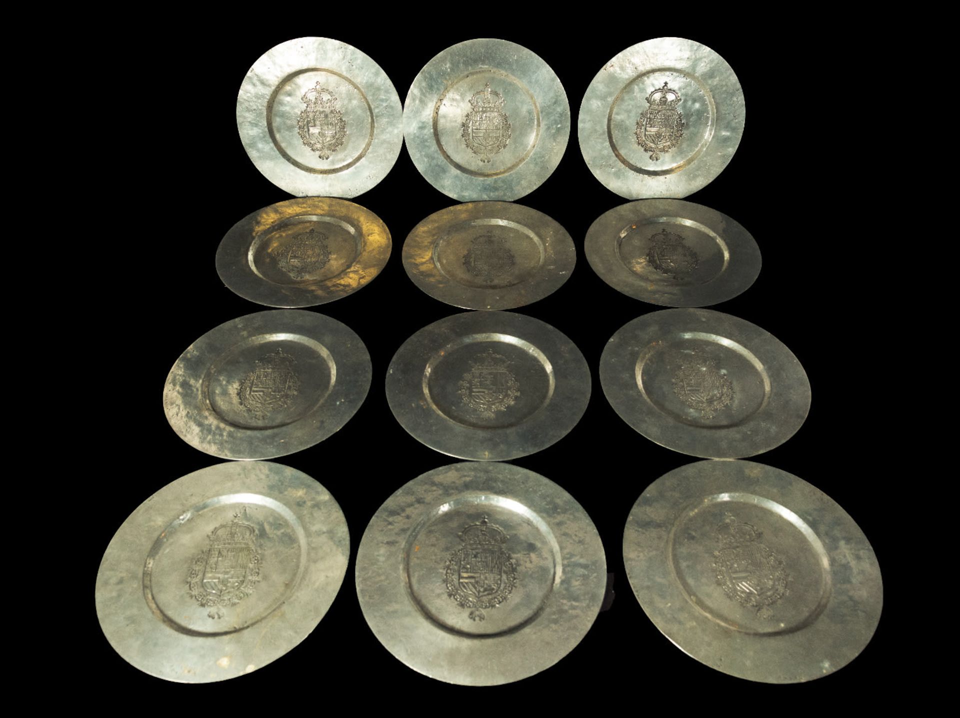 Important decorative set of 12 large display trays in silvered metal in the Spanish Philip II style