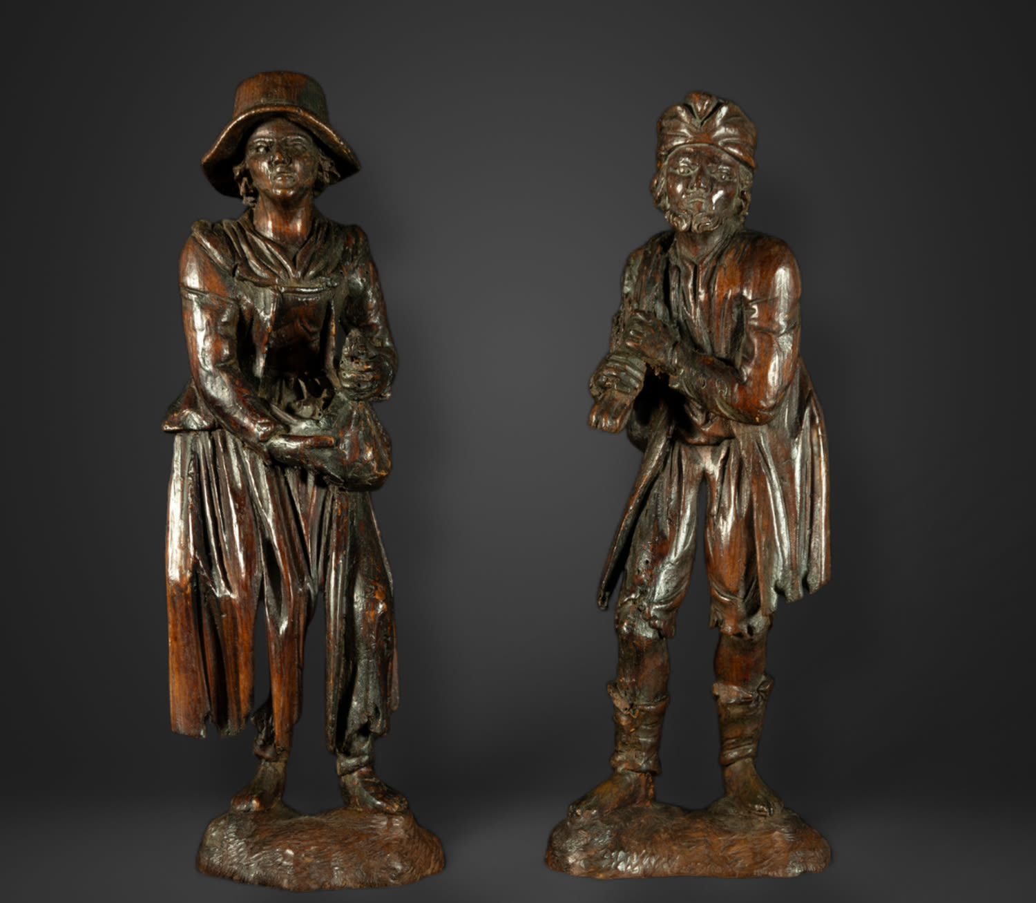 Rare pair of 18th century German Black Forest Beggars, Simon Trojer (manner of)