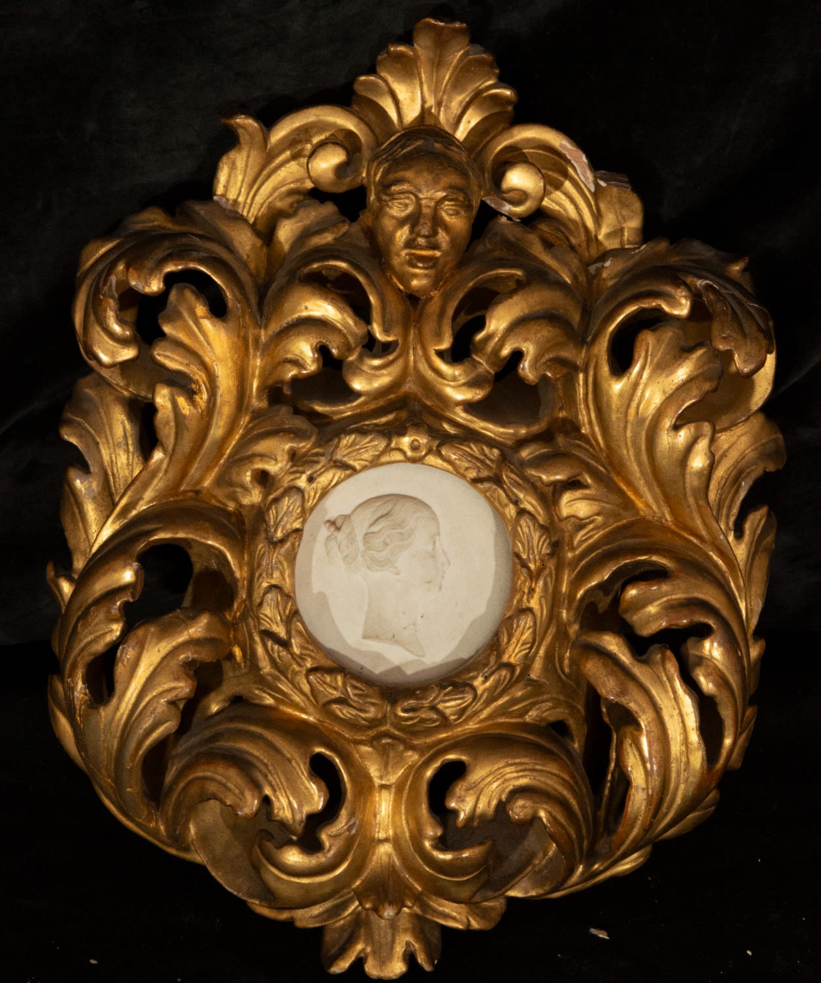 Rococo frame with oval portrait in biscuit porcelain, France, 18th century