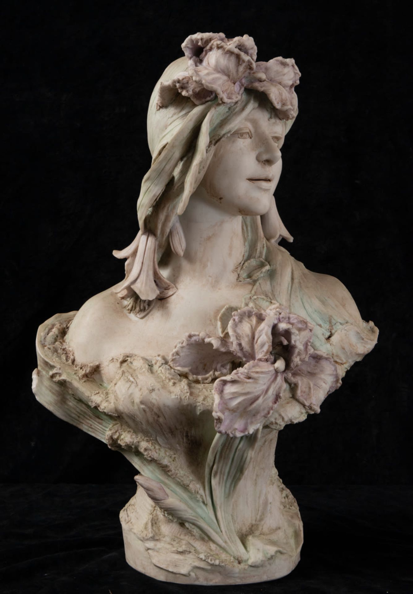Biscuit bust of a young lady with flowers in her hand and head, 19th century