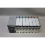 ALLEN BRADLEY 7 SLOT PLC CHASSIS WITH MODULES