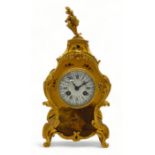 An early 20th century French Louis XV style yellow vernis martin mantel clock