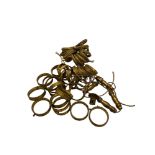 A quantity of early 20th century gilt brass and metal curtain pole rings