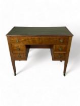 A late George III mahogany kneehole writing desk