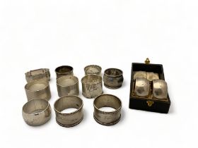 Eleven various silver napkin rings including a pair of cased napkin rings and a silver plated napkin