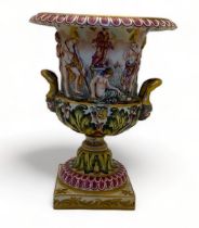 A 19th century Capo di Monte twin handled campagna vase