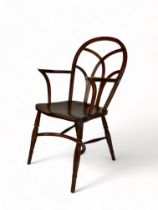 An early 19th century Gothic ash and elm Windsor armchair