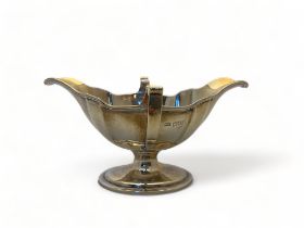 An Edwardian silver twin handled sauce boat, Mappin & Webb, London, 1906