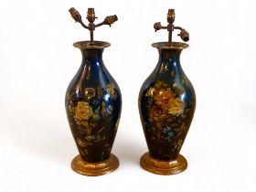 A pair of 19th century papier-mâché floral decorated vases attributed to Jennens and Bettridge