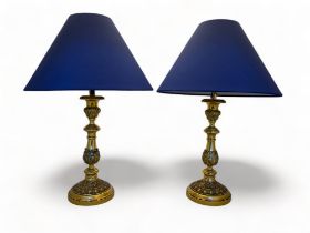 A pair of 19th century French gilt bronze candlesticks converted to table lamps