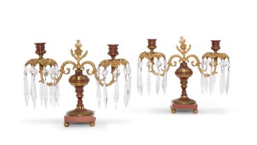 A pair of George IV glass, gilt-metal and cold painted twin-light table candelabra