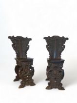 A pair of 19th century Italian Renaissance style carved walnut sgabello chairs