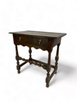 A mid 18th century oak side table