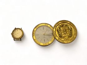 A vintage gilt metal automatic centre seconds wristwatch by Rotary and a gilt metal Swiss desk alarm