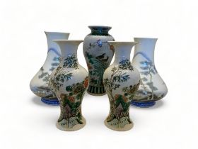 A pair of Japanese porcelain vases, a pair of Chinese baluster vases and another
