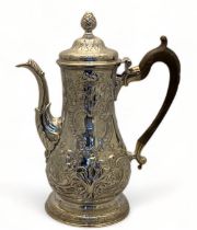 A George III Irish Provincial silver repoussé coffee pot, John Nicholson, Cork, circa 1770