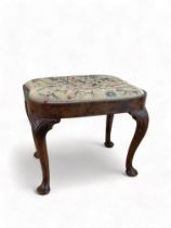 A Queen Anne carved walnut stool