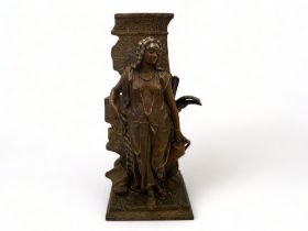 A 19th century Orientalist spelter and brown patinated bronze female water bearer cast after An