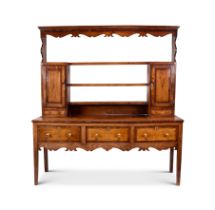A George III oak and mahogany crossbanded dresser