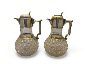 A pair of Victorian hobnail cut lead crystal and silver gilt mounted claret jugs, Walter and Charles