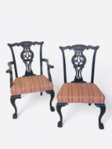 A set of eight carved mahogany dining chairs in the George III style