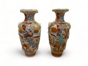 A pair of early 20th century Satsuma earthenware vases and a similar tall vase