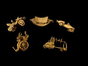Five mid-late 20th century gold charms
