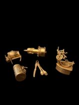 Six mid-late 20th century gold charms
