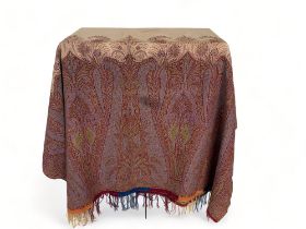 A 19th century red, blue and cream paisley wool and cotton shawl