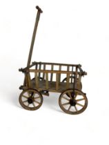 A 19th century oak pull along child's cart
