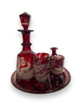 A suite of 19th century Bohemian ruby etched glass