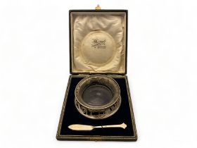 A cased Irish silver butter ring and knife, Roberts & Dore Ltd, Sheffield, 1932, retailed by Sharman