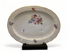 An early 19th century Continental white glazed oval meat plate