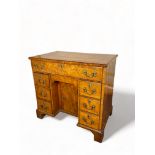 A George III satinwood kneehole desk