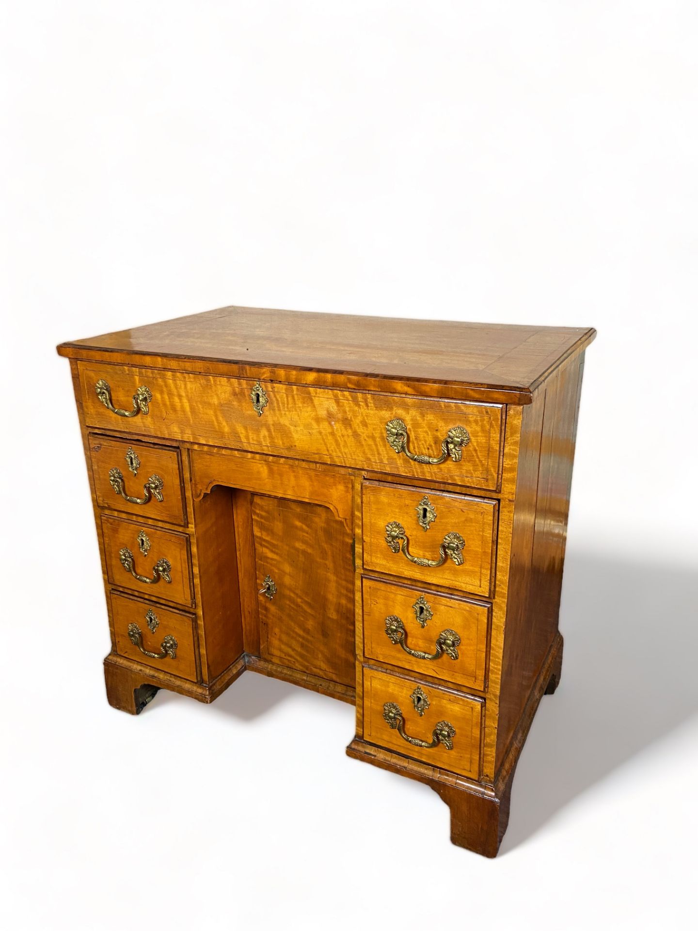 A George III satinwood kneehole desk