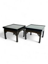 A pair of Mallets black japanned and lacquered coffee tables