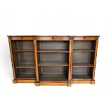 A large Victorian style satinwood dwarf open bookcase